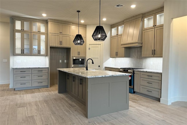 9224 NW 83rd St, Yukon, OK 73099 - kitchen featuring stainless steel appliances, premium range hood, backsplash, gray cabinetry, and recessed lighting