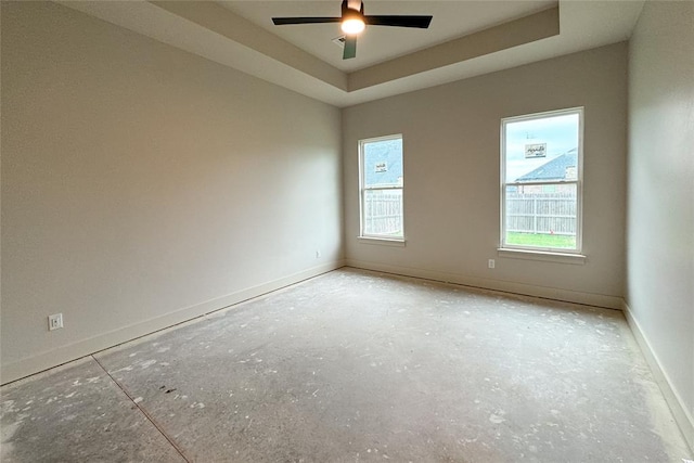 9224 NW 83rd St, Yukon, OK 73099 - unfurnished room featuring ceiling fan, baseboards, and a raised ceiling
