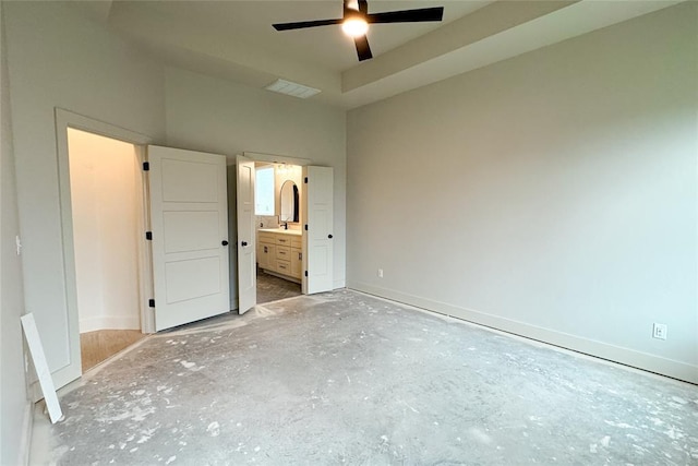 9224 NW 83rd St, Yukon, OK 73099 - unfurnished bedroom featuring baseboards, ensuite bathroom, a sink, and ceiling fan