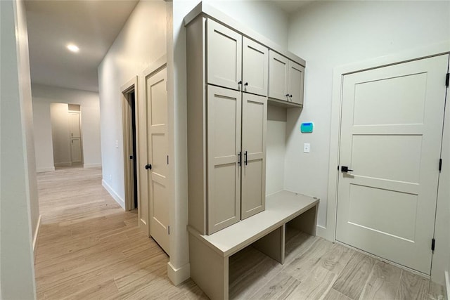 9224 NW 83rd St, Yukon, OK 73099 - mudroom with light wood finished floors, baseboards, and recessed lighting
