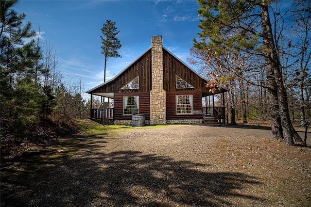 view of property exterior with covered porch