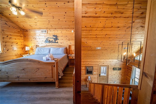 bedroom with ceiling fan, dark hardwood / wood-style flooring, vaulted ceiling, wooden walls, and wood ceiling