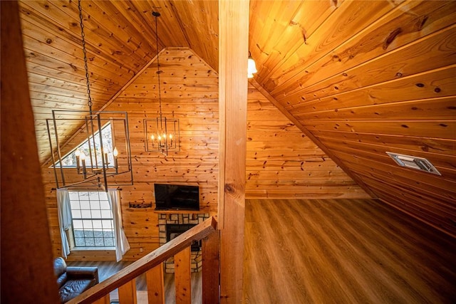 bonus room with hardwood / wood-style flooring, a notable chandelier, wooden ceiling, and vaulted ceiling