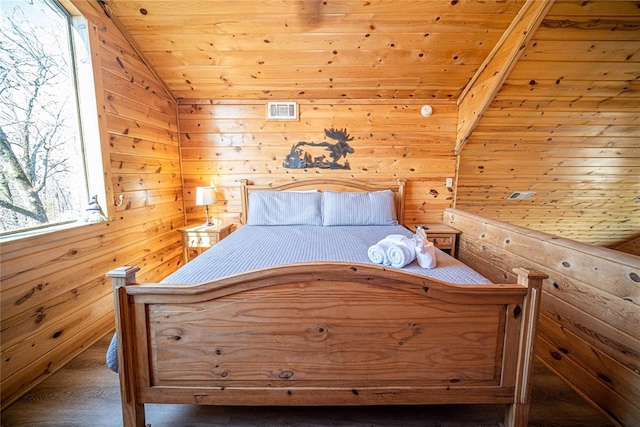 unfurnished bedroom featuring wood walls, wood ceiling, and vaulted ceiling