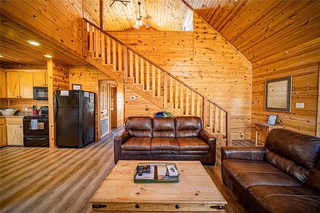 living room featuring hardwood / wood-style flooring, wood walls, wooden ceiling, and high vaulted ceiling