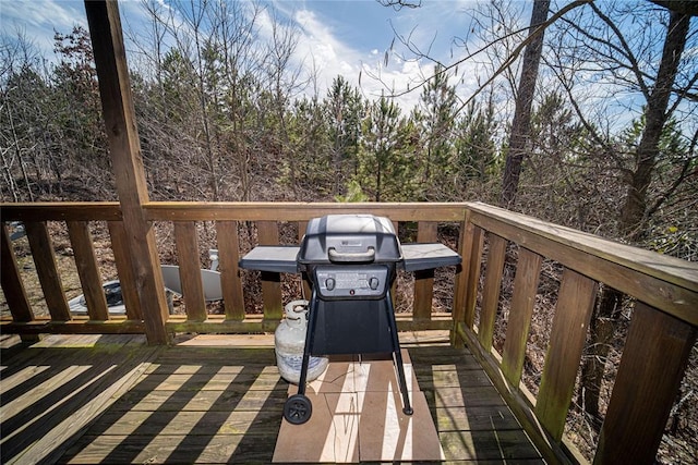 wooden deck featuring area for grilling