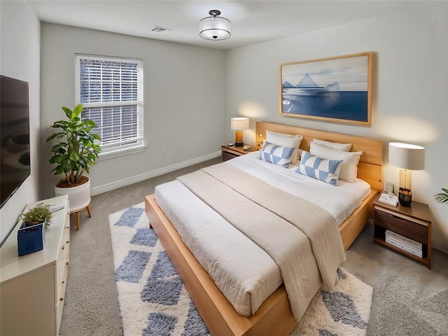 bedroom featuring light colored carpet