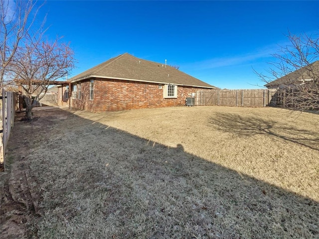 rear view of house with central AC