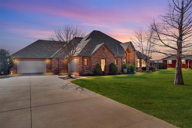 view of front facade featuring a yard and a garage