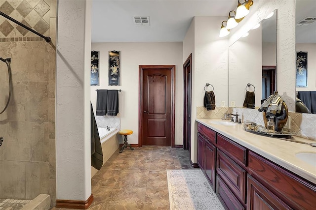 bathroom featuring vanity and separate shower and tub