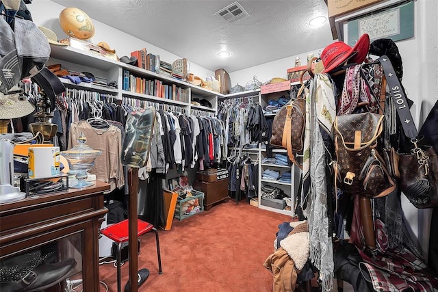 spacious closet with carpet flooring