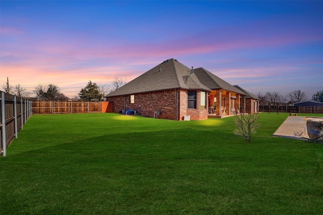 exterior space featuring a patio and a lawn