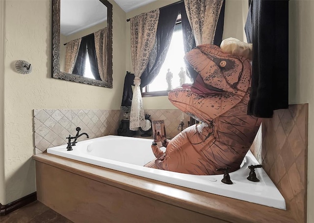 bathroom with a washtub