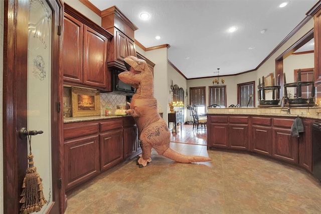 kitchen with tasteful backsplash, sink, ornamental molding, and black dishwasher