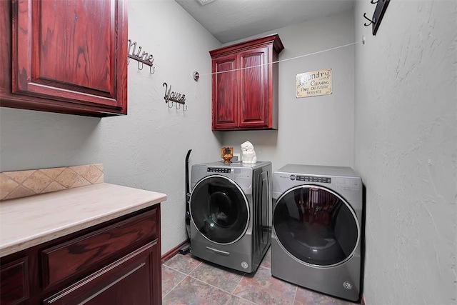 washroom with separate washer and dryer and cabinets