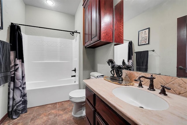 full bathroom featuring vanity, shower / tub combo with curtain, a textured ceiling, and toilet