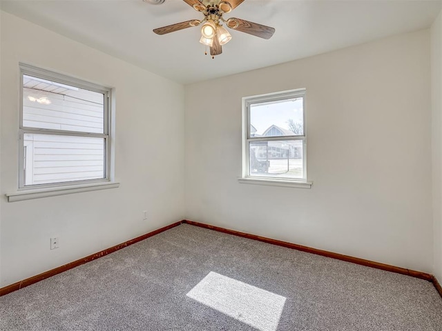 carpeted empty room with ceiling fan