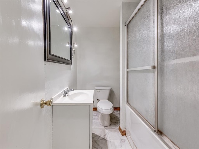 full bathroom featuring vanity, enclosed tub / shower combo, and toilet