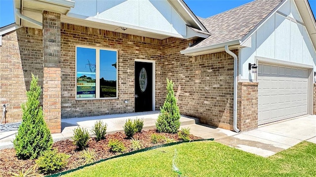 doorway to property with a garage