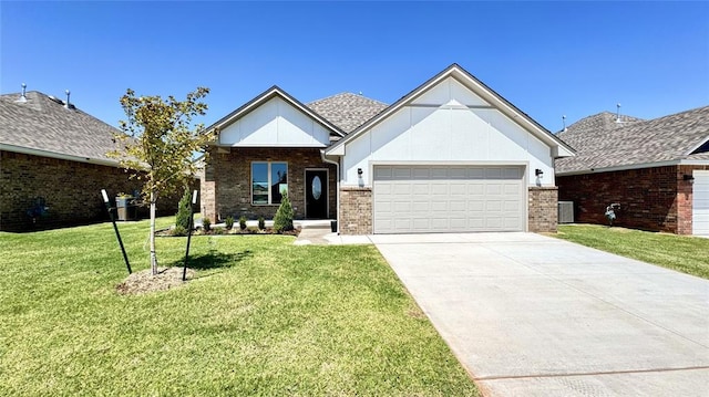 view of front of property with a garage and a front lawn