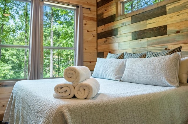 bedroom with wooden walls