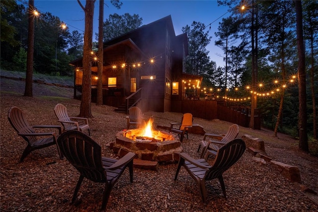 patio terrace at dusk with a fire pit