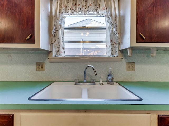 kitchen with sink and tasteful backsplash