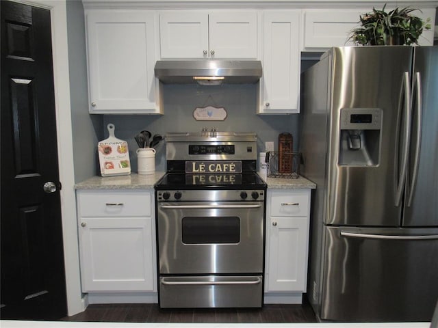 kitchen with white cabinetry, dark hardwood / wood-style flooring, light stone countertops, and appliances with stainless steel finishes