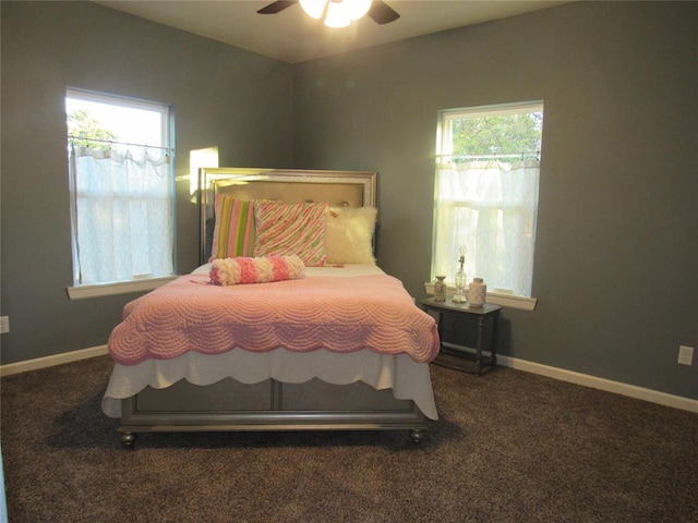 bedroom featuring multiple windows, ceiling fan, and carpet flooring