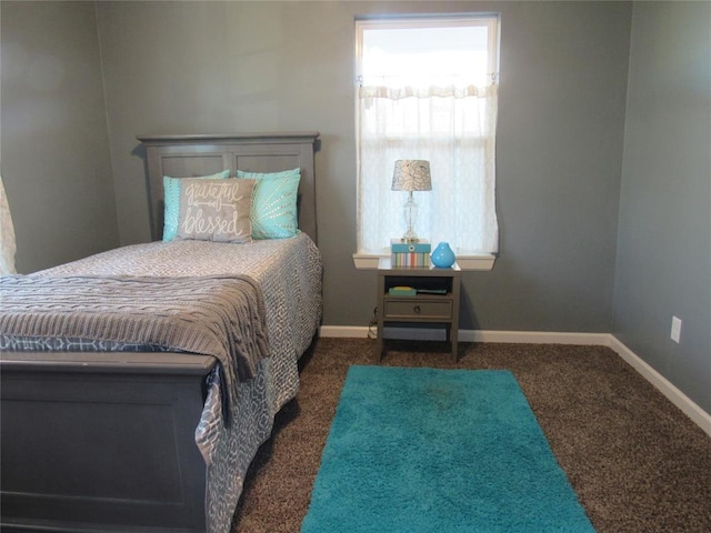 bedroom with baseboards and carpet floors