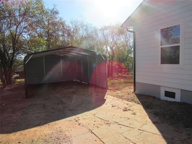 view of outdoor structure with a carport