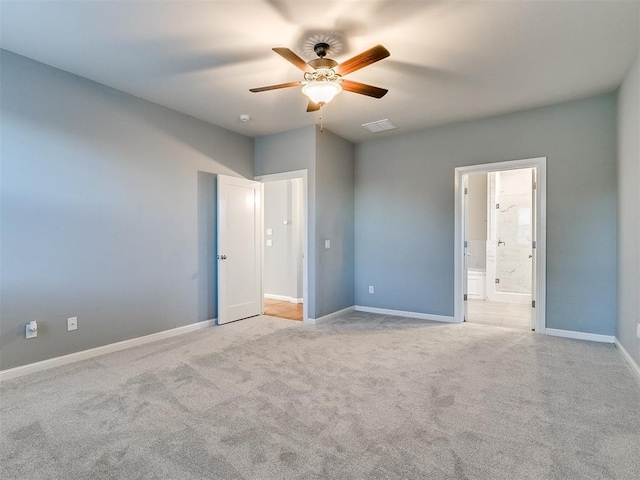 unfurnished bedroom with light carpet, ensuite bathroom, and ceiling fan