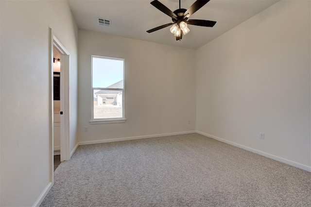 carpeted empty room featuring ceiling fan