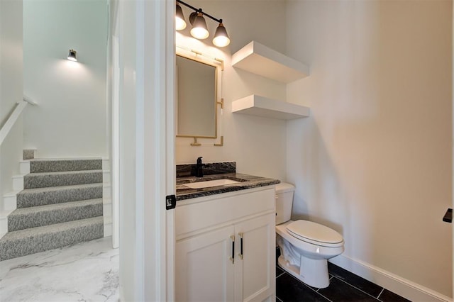 bathroom with vanity and toilet