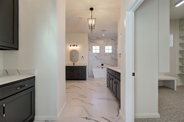 2270 NW 227th St, Edmond, OK 73025 - full bathroom featuring marble finish floor, baseboards, a freestanding tub, and a marble finish shower