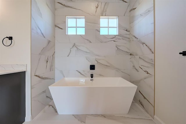 2270 NW 227th St, Edmond, OK 73025 - bathroom featuring a soaking tub, marble finish floor, and a sink