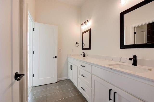 2270 NW 227th St, Edmond, OK 73025 - full bathroom featuring tile patterned floors, baseboards, a sink, and double vanity