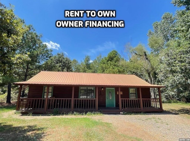 609 Canoe Rd, Broken Bow, OK 74728 - view of front of house featuring a porch and a front yard