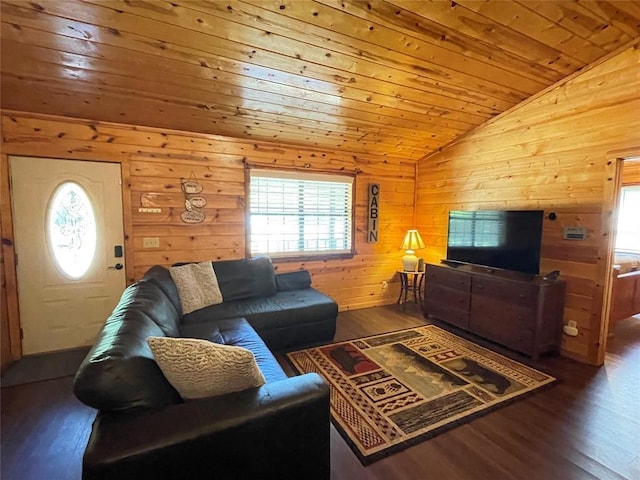 living room with wood walls, plenty of natural light, wooden ceiling, and vaulted ceiling