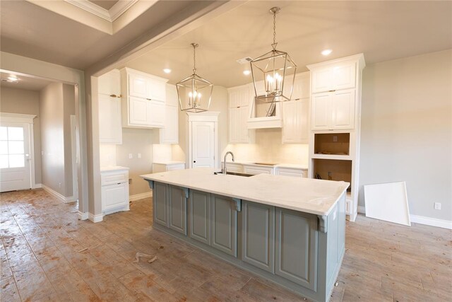 16024 Coneflower Dr, Edmond, OK 73013 - kitchen featuring gray cabinetry, a sink, recessed lighting, a large island, and white cabinetry