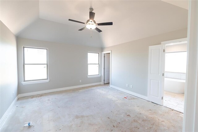 16024 Coneflower Dr, Edmond, OK 73013 - spare room with lofted ceiling, unfinished concrete flooring, a ceiling fan, and baseboards