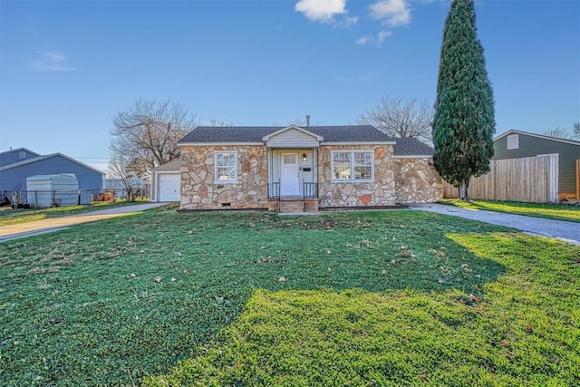 ranch-style house with a front yard and a garage