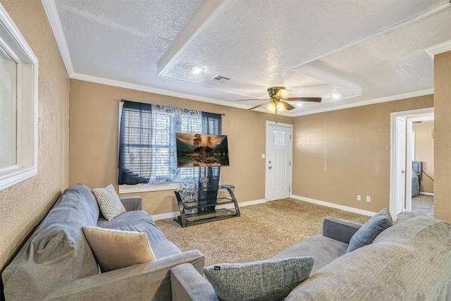 living room with ceiling fan, light colored carpet, a textured ceiling, and ornamental molding