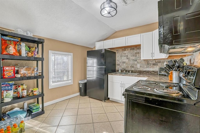 kitchen with backsplash, vaulted ceiling, sink, black appliances, and white cabinetry