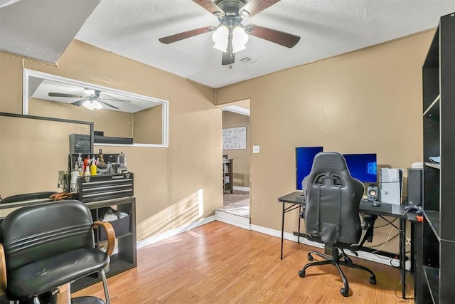 office space with hardwood / wood-style flooring and a textured ceiling