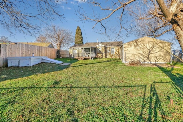 view of yard featuring a wooden deck