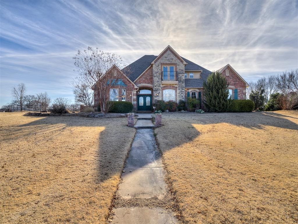 view of front facade featuring french doors and a front yard