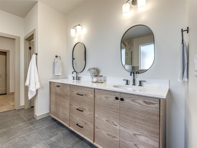 bathroom with tile patterned flooring and vanity