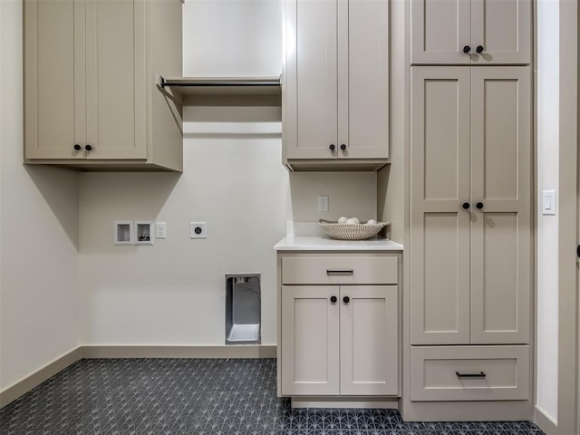 laundry area with cabinets, washer hookup, and hookup for an electric dryer