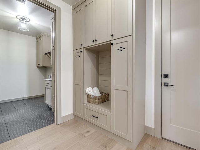 mudroom with light hardwood / wood-style flooring